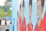 高清图：金妍儿画壁画助韩国 花滑女王微笑甜美
